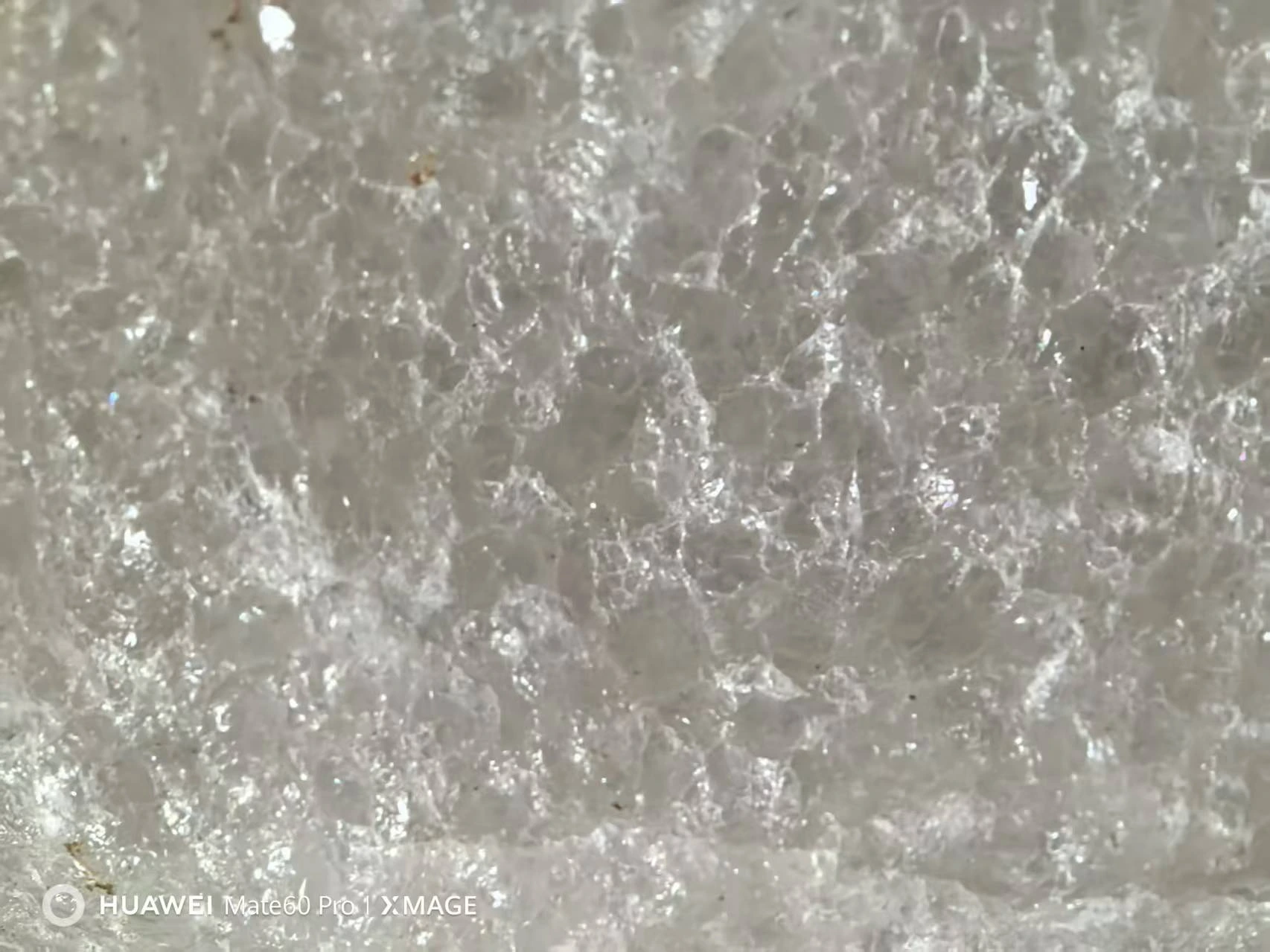 Quartz material moving through an industrial processing facility